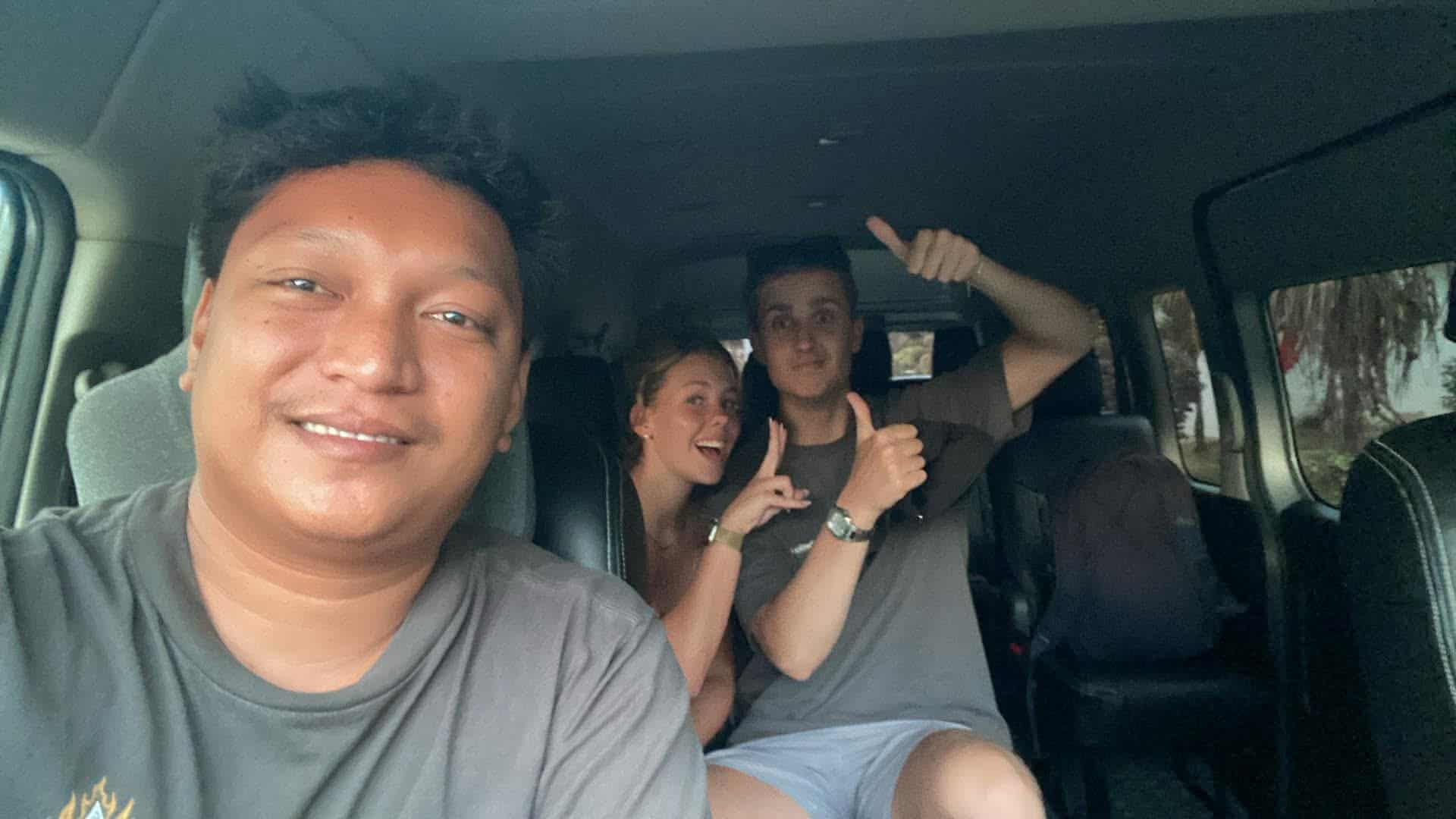 Driver and passengers inside an air-conditioned private van in Siargao