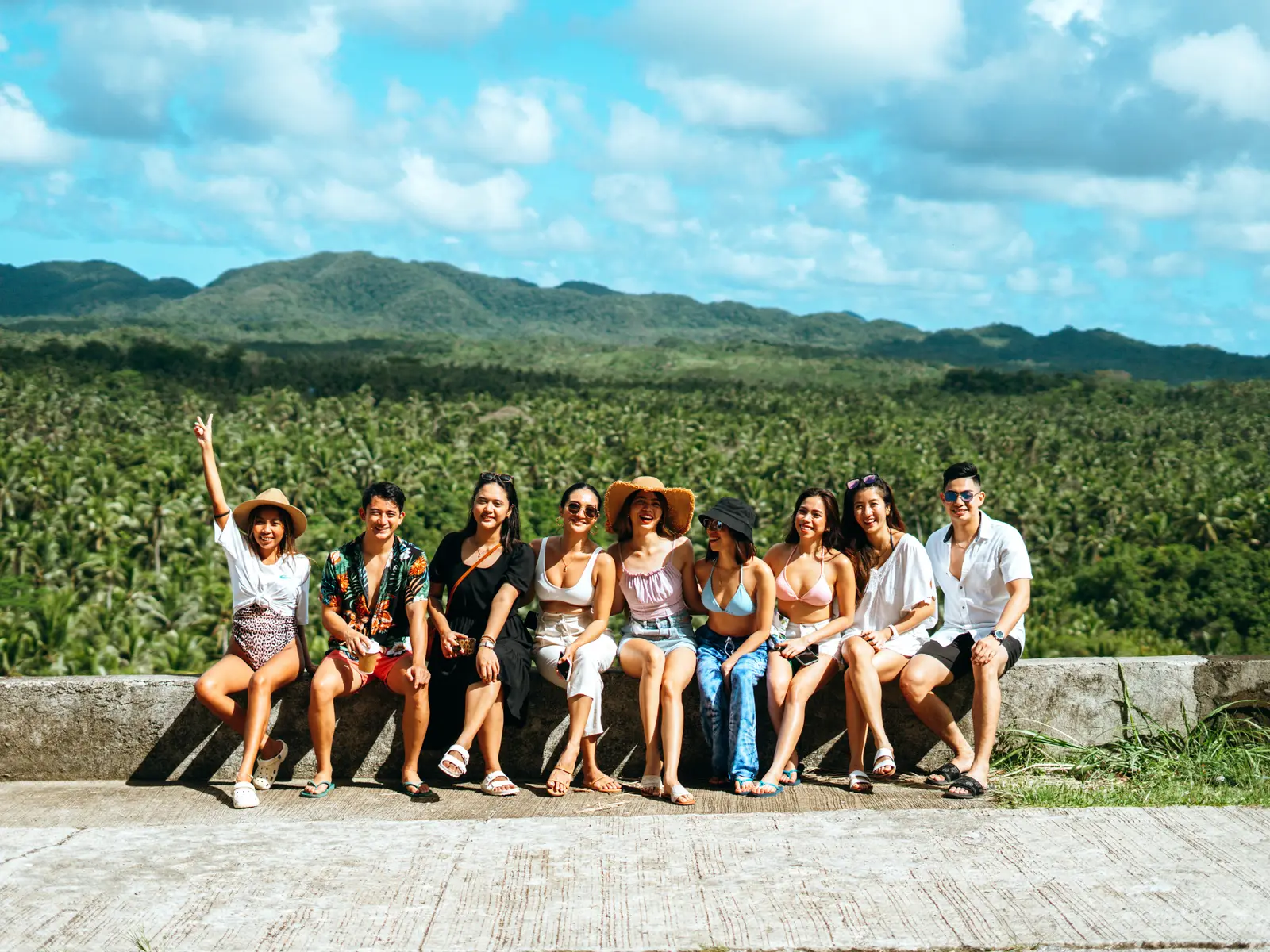 Travelers at a coconut-palm viewpoint over Siargao's interior on a private land tour